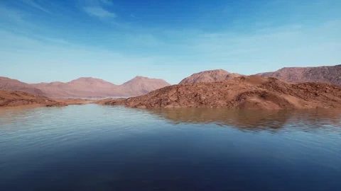 The camera moves to the left, showing lake bays and rocky shores on a summer day Stock Footage 253965350