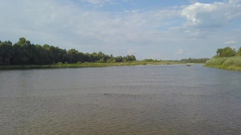 The camera moves low above the surface of the river Video stock 117413546