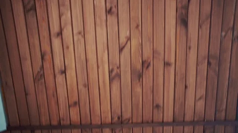 The camera moves next to a wooden wall or fence, abstract background Stock Footage 106820455