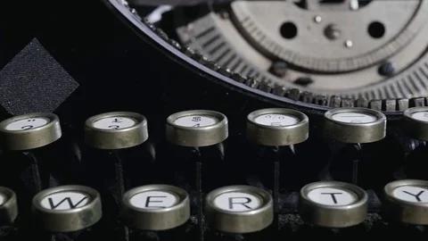Camera moves on a old black vintage manual typewriter keyboard Stock Footage 75209918