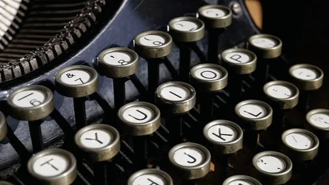 Camera moves on a old black vintage manual typewriter keyboard Stock Footage 75210232