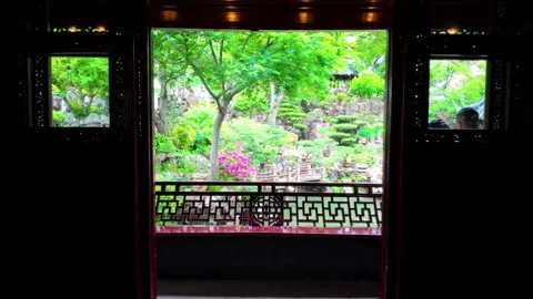 Camera Moves from Ornate Traditional Interior to Lush Garden Pond with Stockbeeldmateriaal 336770158
