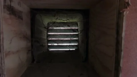 Camera moves out of ventilation duct in wall. Video stock 147233242