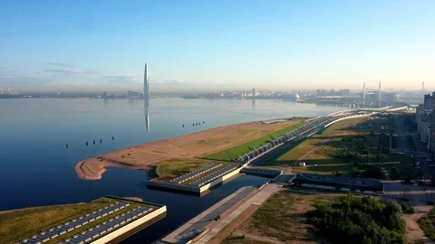 The Camera Moves Over A Modern Highway Against The Skyscraper Stock Footage 115830007