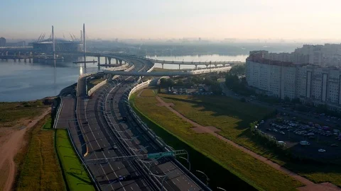 The Camera Moves Over A Modern Highway Against The Skyscraper Stock Footage 117363354
