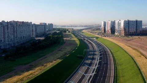 The Camera Moves Over A Modern Highway Against The Skyscraper Stock Footage 117363992