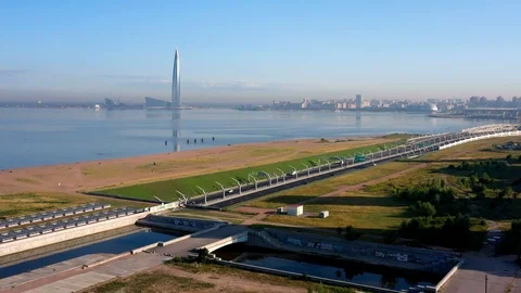 The Camera Moves Over A Modern Highway Against The Skyscraper Stock Footage 117364845