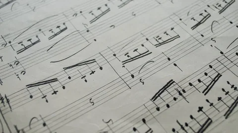 Camera moves over the sheet with notes, close up, macro view, slider  動画素材 126863099