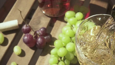 The camera moves over the table with grapes and wine slow motion Stock Footage 88996737