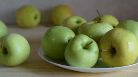The camera moves in a panorama. large green apples. UHD Video Stock Footage 186994719