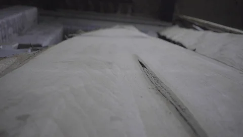 Camera moves up piece of old tree drying lumber pine self employed carpenter  스톡 동영상 100412379