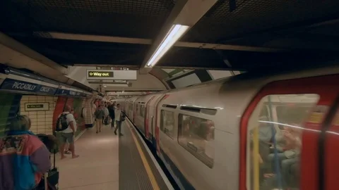 Camera moves from platform to underground tube train  스톡 동영상 94120530