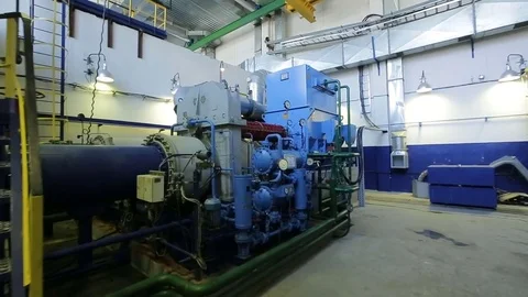 Camera Moves to Powerful Industrial Compressor with Pipes Stock Footage 78905603