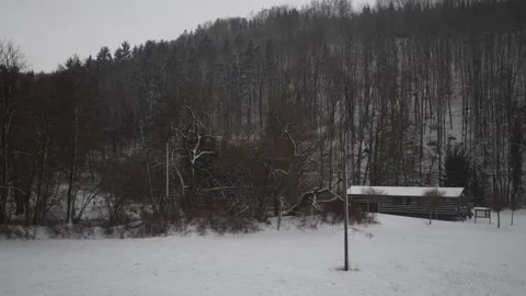 The camera moves quickly past a snowy private sector with scattered houses and b 스톡 동영상 298259103