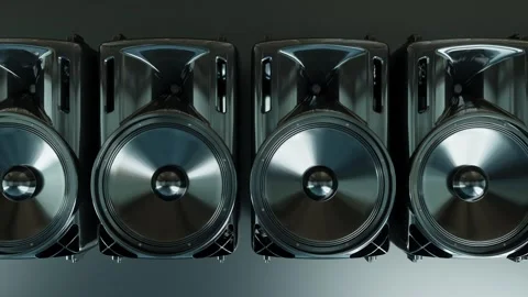 Camera moves to the right in front of a row of working black loudspeakers Stock Footage 285900074