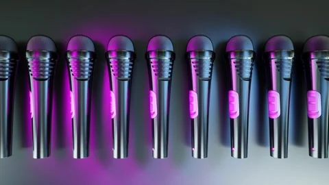 Camera moves right over row of black microphones under ultraviolet light Stock Footage 285899969
