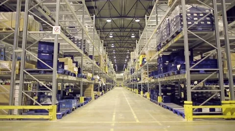 Camera moves up on shelves of cardboard boxes inside a storage warehouse Stock Footage 61122974