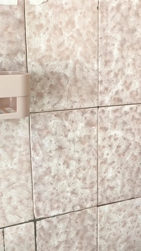 The camera moves sideways and shoots sponges in a plastic container, towels on Stock Footage 315154477