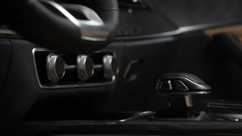 The camera moves slowly along the buttons in the interior of the premium car Stock Footage 270486277