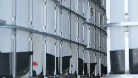 Camera Moves Slowly along Intermediate Bulk Containers Stock Footage 76086749