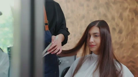 The camera moves slowly through the mirror. Professional barber, men are usin Stock Footage 153820820