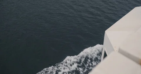 Camera moves up from the stern of the ship and goes to a stunning landscape shot 動画素材 96073771