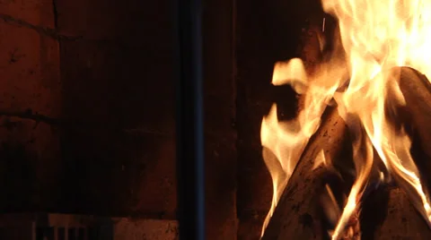 The camera moves to take a close-up of burning fireplace Stock Footage 37635124