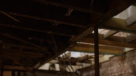 Camera moves through an abandoned building with the view on the exposed and dete Stock Footage 111190420