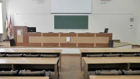 Camera Moves Through Empty Seats in Modern Lecture hall With Projector Scre Stock Footage 196885802