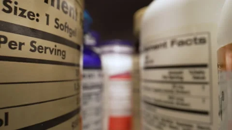 The Camera Moves Through Many Containers of Dietary Supplements, Pills. Plastic Video stock 223647060