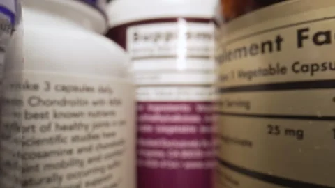 The Camera Moves Through Many Containers of Nutritional Supplements, Pills Stock Footage 247175105