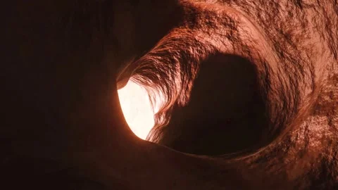 Camera moves through mysterious dark tunnel with bright light at end Stock Footage 327569256
