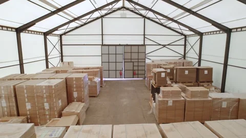 Camera moves through the raw material warehouse in a furniture factory Stock Footage 244125624