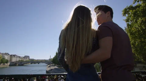 Camera moves through shot as a young couple kiss Stock Footage 63018972