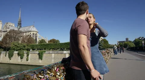 Camera moves through shot as a young couple talk. Stock Footage 63020195