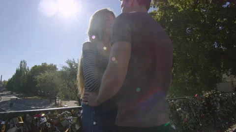 Camera moves through shot as a young couple talk. Video stock 63021810