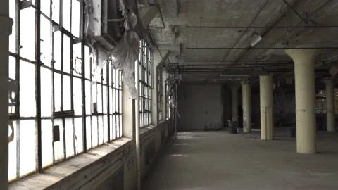 The camera moves through a simple warehouse hall. Stock Footage 225534280