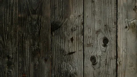 The camera moves from top to bottom along the burnt wooden boards. Stock Footage 153741747