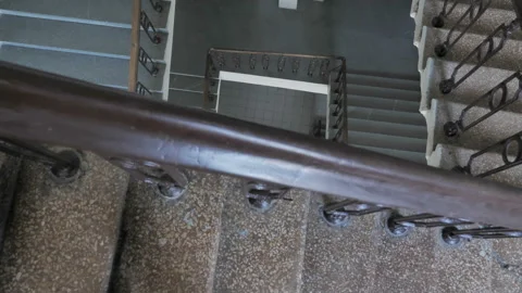 Camera Moves From Top To Bottom And Shots Stair Flights In A Multistorey Stock Footage 132640010