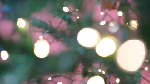 Camera moving across the blurred tree branches with blinking light, winter Stock Footage 253099349