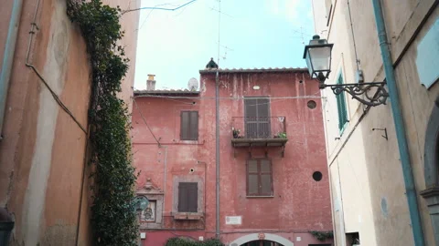 Camera moving along the ancient characteristic street of old village Tuscania in Stock-Footage 156180167