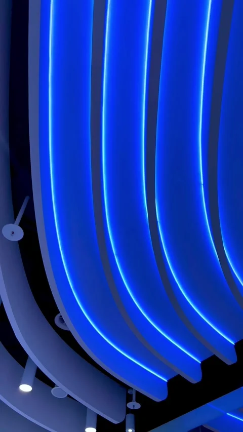 Camera moving along futuristic blue neon ceiling lights Stock Footage 335840024