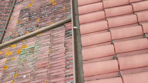 Camera moving along old dirty roof tiles of residential building or private Video stock 317192213