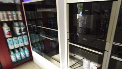 Camera moving along the row of wine coolers and ovens at the domestic appliance Stock Footage 141250261