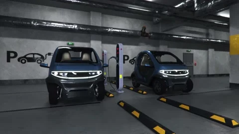 Camera is moving around 2 electric cars at charging station in a parking lot Stock Footage 226985584