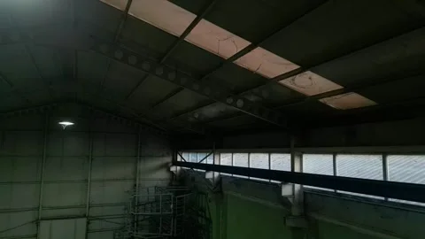 Camera moving around the ceiling of the large Warehouse 動画素材 257665115