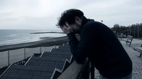 Camera moving around lonely sad man feeling desperate  in winter 4K Stock Footage 58330374