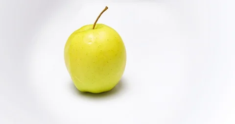 Camera moving around one yellow apple 動画素材 122340706