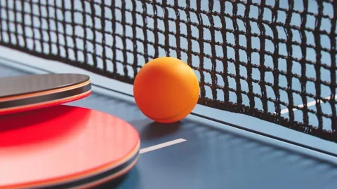 The camera is moving around a table tennis ball. Ping pong ball, paddles and net Stock-Footage 133437172