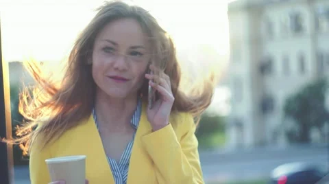 Camera moving around young beautiful business woman. Brunette girl talking by Stock Footage 65405395